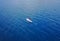 Aerial view of Unidentified women tourist paddling a surfboard t