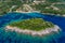 Aerial view of uninhabited island near of Agia Paraskeui Beach with turquoise sea in Parga area, Ionian sea, Epirus, Greece