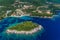 Aerial view of uninhabited island near of Agia Paraskeui Beach with turquoise sea in Parga area, Ionian sea, Epirus, Greece