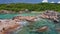 Aerial view of unique coastline with nature granite boulders on remote paradise like beach hidden in jungle. La Digue