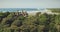 Aerial view of unique Indonesia houses roofs at ocean bay sand coast, green tropic jungle landscape