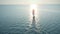 Aerial view of an unknown sailboat with pink sail moving on the sea in the evening