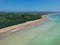 Aerial view of an unoccupied beach with a tranquil blue sky above