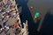 Aerial view of unrecognizable tourist walking on the Charles Bridge with small boat on Vltava river, Prague, Czech Republic