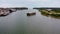 Aerial view of unserviceable barge boat anchored in harbor waiting maintenance.