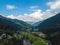 Aerial view from the valley head of the Hinterglemm Mountains to Hinterglemm and Saalbach on a summer day in the Alps at