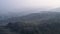 Aerial view of the valley, hills. Misty mystical morning 4k