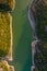 Aerial view of the valley, olive fields and Embalse de Forata reservoir during sunset. Summer in Spain