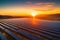 Aerial view of a vast solar farm, with thousands of photovoltaic panels