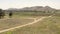 Aerial View of Vehicle on Dusty Road and Vineyard Plantation in California