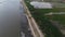 Aerial view of vehicles driving on a road crossing the Limboto Lake