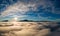 Aerial view of vibrant sunrise over white dense fog with distant dark Carpathian mountains on horizon