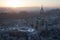 Aerial view of the vibrant urban cityscape of Saudi Arabia, featuring a towering spire.