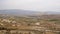 Aerial view of village and cars on road in scenic valley