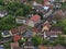 Aerial view of village Honau, Swabian Alb, with main road, old buildings and cars passing by in late spring with green trees.