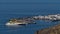 Aerial view of village Puerto de las Nieves on the northwestern coast of Gran Canaria, Spain with Fred. Olsen Express ferry.