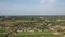 Aerial view of village. Some ponds. Rooftop of buildings. Natural ricefields.