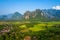 Aerial view of village Vang Vieng and  Nam Song rive , Laos. Southeast Asia. Photo made by drone from above. Bird eye view