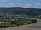 Aerial view of villages Filsen and Boppard, located on Rhine riverbank in Germany with forests and hills.