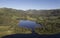 Aerial view and vista of the Langdale Pikes from above Elterwater in the glorious English Lake District