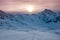 Aerial view of vivid beautiful sunset over snowy ski resort