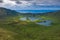 Aerial view of volcanic crater Caldeirao with a beautiful lake on the top of Corvo island. Azores islands, Portugal