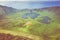 Aerial view of volcanic crater Caldeirao with a beautiful lake on the top of Corvo island. Azores islands, Portugal