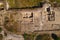 Aerial view with the walls of an old ancient fortress discovered on a field