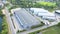 Aerial view of warehouse storages or industrial factory or logistics center from above. Top view of industrial buildings and