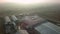 An aerial view of warehouses near the suburban road