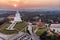 Aerial view of Wat Huay Pla Kang temple with Guanyin and church at sunset