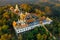 Aerial view of Wat Phrathat Doi Kham, Buddha pagoda and golden chedi in Chiang Mai, Thailand