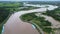 Aerial view of the water released from the concrete dam`s drainage channel as the overflow in the rainy season. Top view of turbid