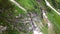 Aerial view of the waterfall highly in the Alpine mountains