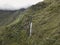 Aerial view of a waterfall in the Peruvian Andes.