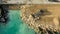 Aerial view of waterfront construction site with excavator. Bulldozer working on a breakwater construction