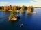 The aerial view of the waterfront residential area surrounded by striking fall foliage by St Lawrence River of Wellesley Island,