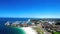 Aerial view of the waterside city buildings under the blue sky in Western Australia