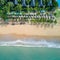 Aerial view of wave reaching coastline and resort