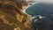 Aerial view: Waves crash along the rocky coast of Big Sur in Monterey County