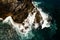 Aerial view of waves crashing on rocks,Seascape birds eye view photo shot over ocean waves, Image for nature background and travel