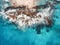 Aerial view of waves, rocks and transparent sea