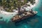aerial view of a weathered pirate ship anchored near a deserted island