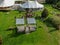 Aerial view of wedding reception ceremony setup with big white tents