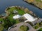 Aerial view of wedding reception ceremony setup with big white tents