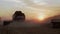 Aerial view of wheat three silhouette of harvests with sunset on backgrounds