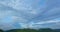 aerial view white cloud in blue sky above the green mountain