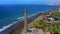 Aerial View of White Lighthouse Facing Clear Sea, Belitung Island, Indonesia