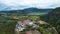 Aerial view of white mosque in a beautiful landscape view of Harau Valley with mountains valley and grass view, Beautiful