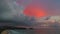 .aerial view white rain cloud on pink sky in sunset at Karon beach Phuket.